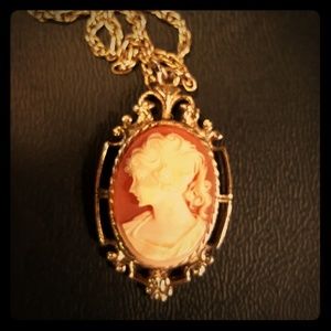 Peach cameo necklace.